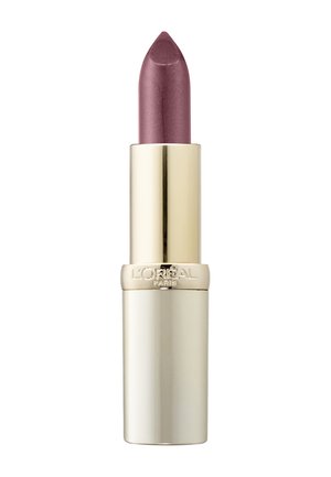 Rossetto in un tubo cilindrico dorato con punta affusolata. Il colore è una tonalità mauve lucida con una finitura brillante.