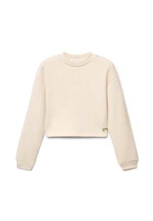 Felpa beige cropped a maniche lunghe con scollo rotondo e piccolo dettaglio di fiocco metallico vicino all'orlo su sfondo bianco.