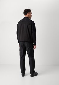 HUGO LUNUS - Γιλέκο - black