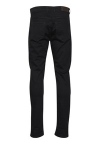 Zwarte skinny jeans van denim, met een middelhoge taille, achterzakken met een decoratieve stiknaad en een leren patch in bruin op de taille.