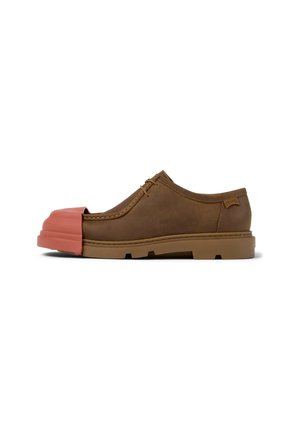 Brown leather shoe with a pink rubber toe cap, flat sole, and lace-up design. Features a smooth texture and rounded shape.