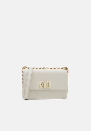 Small rectangular cream leather crossbody bag with gold chain strap and gold turn-lock closure on front flap.