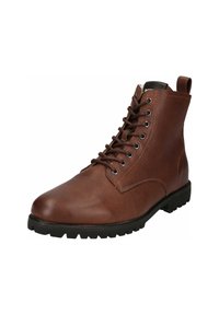 Stivaletto in pelle marrone con punta rotonda, lacci frontali, suola in gomma robusta e linguetta sul tallone per un facile indossamento. Presenti dettagli di finitura testurizzata.
