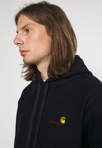 Carhartt WIP HOODED AMERICAN SCRIPT  - Sweatshirt com capuz - astro