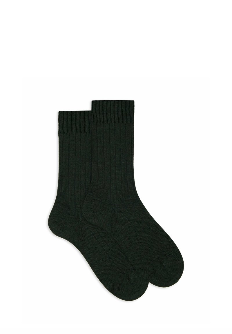 Calzini a coste verde scuro, con polsino spesso e tessitura liscia. Progettati per comfort e calore, adatti all'uso quotidiano.