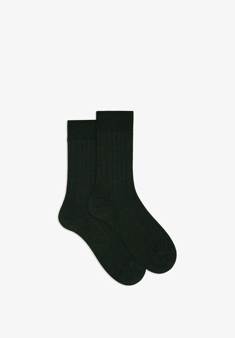 Calzini a coste verde scuro, con polsino spesso e tessitura liscia. Progettati per comfort e calore, adatti all'uso quotidiano.
