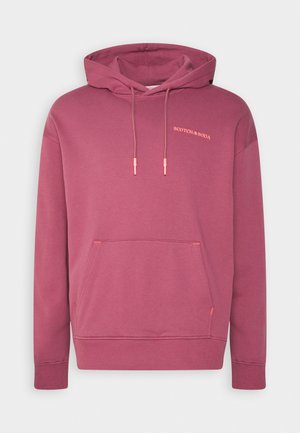 Fioletowy pulower z kapturem, z kieszenią z przodu, regulowanymi sznurkami i małym logo "Scotch & Soda" na górnej lewej piersi.