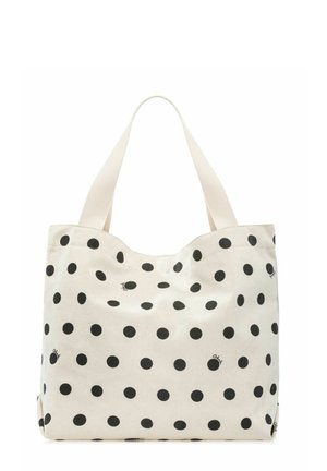 Beżowa torba na ramię w czarne grochy z dwoma szerokimi materiałowymi uchwytami, zaprojektowana do użytku codziennego lub na zakupy.