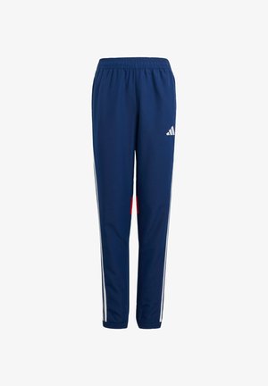 Navy track pants with elastic waistband, white side stripes, red pocket accent, and tapered legs. Made from lightweight, flexible material.