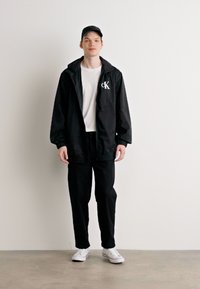 Calvin Klein Jeans CROPPED - Pantaloni - black