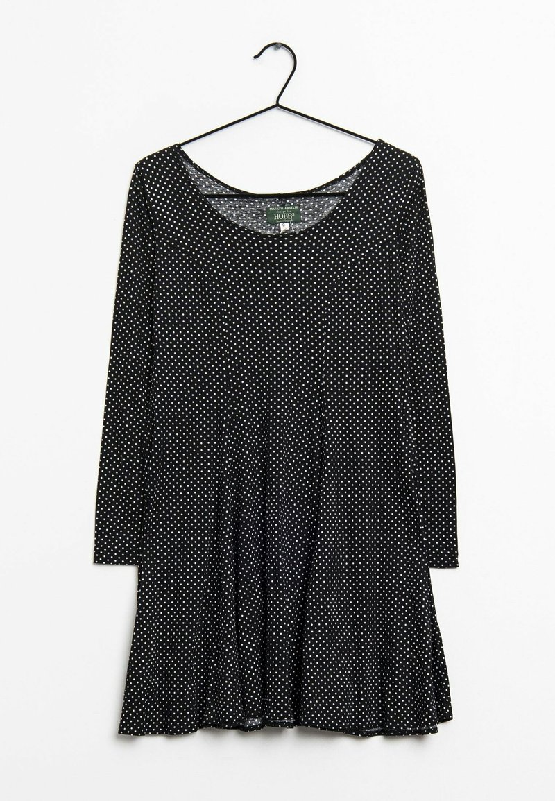 Zwart lang mouw jurk met witte stippen, ronde halslijn en uitgerichte zoom. Gemaakt van zachte stof met een gladde textuur.
