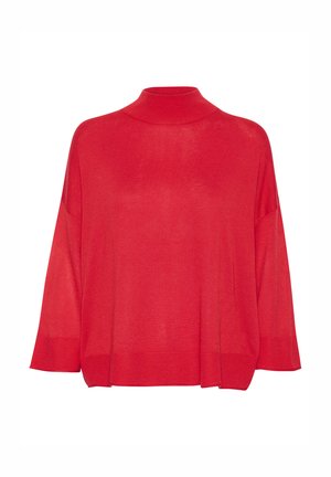 Pull à col roulé en tricot rouge, avec une coupe ample, des épaules tombantes et des accents côtelés aux poignets et à l'ourlet. Texture légère.