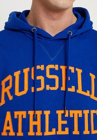 Russell Athletic Eagle R ICONIC TACKLE - Jersey con capucha - navy/orange