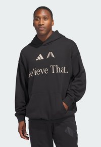 Schwarzer Hoodie aus Baumwollmischung, mit einer Fronttasche, besticktem Text "Believe That." und drei weißen Streifen-Logo.