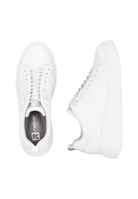 White sneakers with a smooth leather texture, round toe, and thick rubber sole. Features lacing and a logo on the insole.