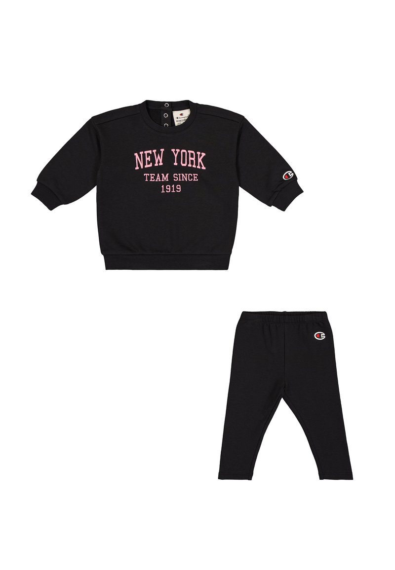 Black sweatshirt with pink 'NEW YORK TEAM SINCE 1919' text, crew neck, and snap button details, paired with black leggings featuring logo.