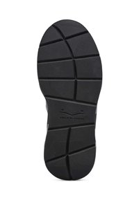 Black rubber sneaker sole featuring a textured surface with diagonal grooves and a logo, designed for traction and durability.