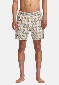 Men's swim trunks in a cream color with a multicolored abstract pattern. Features an elastic waistband and a small logo patch on the side.