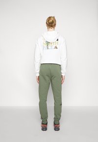 The North Face Träningsbyxor - dark green