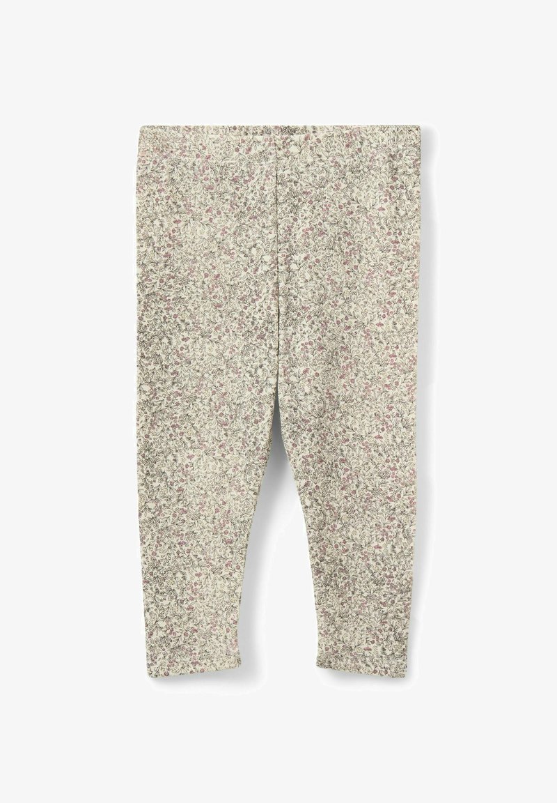Leggings pour enfants de couleur beige avec un motif floral discret en tons roses et verts atténués, étalés à plat sur un fond blanc.