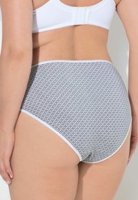 Höga trosor f�ör kvinnor i grått och vitt med ett geometriskt mönster. Mjuk tyg med en slät, elastisk midja.