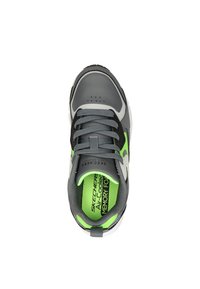 Gray athletic shoe with black and vibrant green accents, textured synthetic upper, lace-up design, and padded collar. Memory foam insole visible.