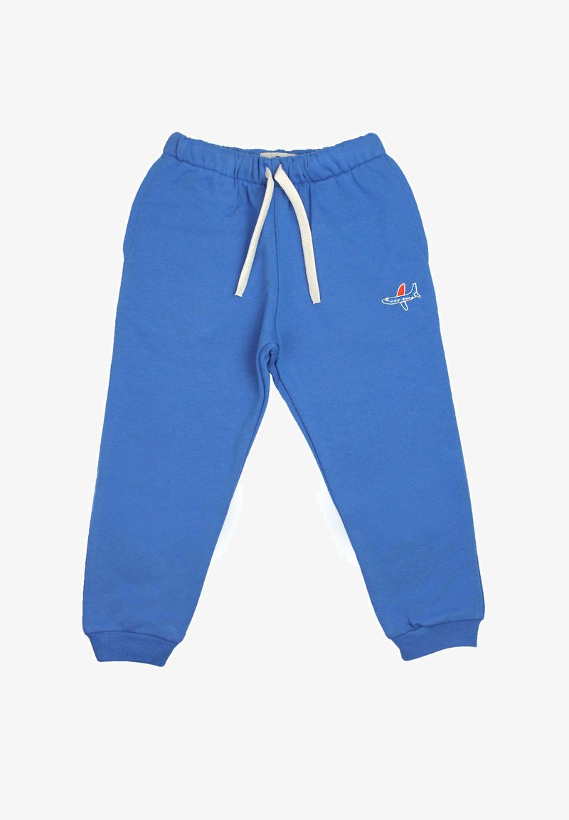 Jogging bleu fabriqué en mélange de coton, doté d'une taille élastique avec cordons blancs et d'un petit logo d'avion sur le côté.