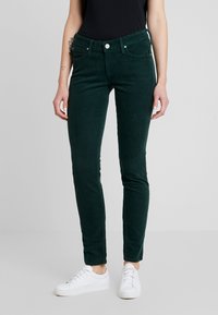 Gröna kordfläskbyxor med slim fit, med en klassisk femficksdesign, framknäppning och vita sömnadsdetaljer.