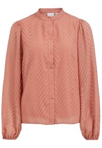 Rosa blus med ett zigzagsmönster, med en mandarinkrage, knappstängning fram och långa puffärmar med elastiska manschetter. Lättviktsmaterial.