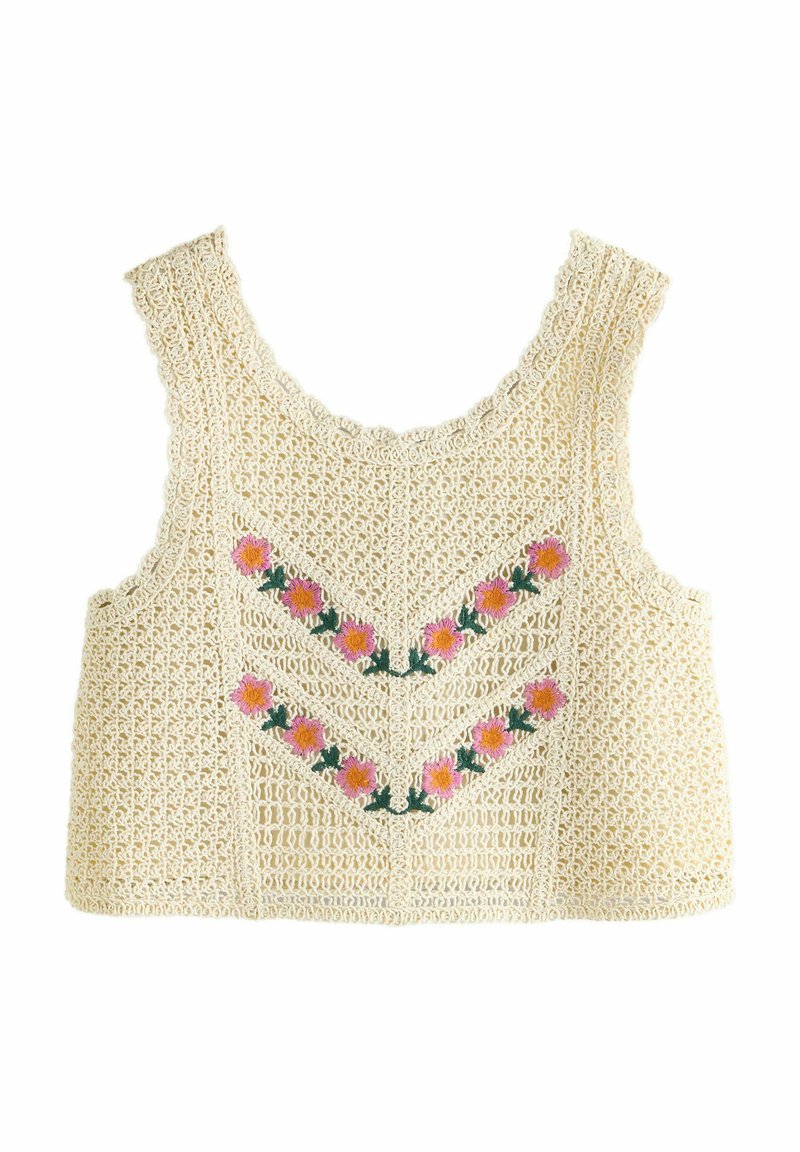 Débardeur en crochet beige avec un col festonné. Il présente une broderie florale en rose et vert, ainsi qu'un motif en chevrons à l'avant.