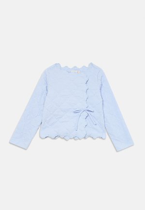 Light blue long-sleeve jacket with a textured floral pattern, scalloped edges, and a tie closure at the waist. Smooth fabric finish.