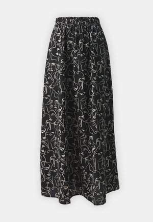 Jupe maxi avec une taille élastique, en tissu noir orné de contours de visages abstraits blancs, texture lisse et design fluide.
