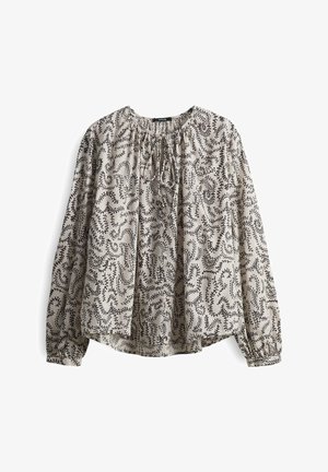 Long-sleeve blouse in light beige with black abstract pattern. Features a gathered neckline and loose fit, made from lightweight fabric.