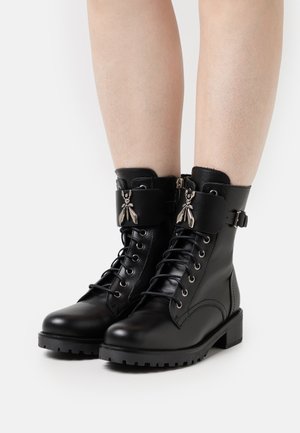 Lace-up ankle boots - nero/gold fly