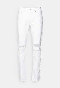 Vita denimjeans med slim fit, med två hål vid knäna, fem fickor, knappstängning och subtila kopparfärgade detaljer.