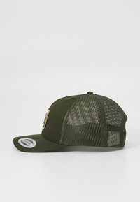 Olive green cap with a solid front, mesh back, and a curved brim. Features a rectangular patch on the front. Adjustable strap at the back.