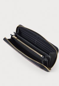 Black leather wallet with gold zipper, internal card slots, and a central zip compartment. Smooth texture, minimalist design.