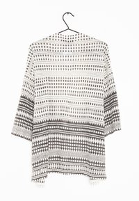 Leichter Kimono mit offenem Vorderteil in Creme und Dunkelgrau. Mit geometrischen Mustern und dreiviertellangen Ärmeln in fließender Form.