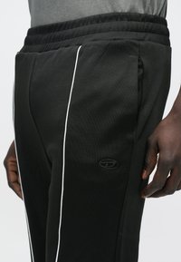 Diesel LOCKING - Pantalones deportivos - black