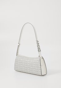 Gray rectangular handbag with DKNY logo pattern, white accents, and a slim adjustable strap. Zipper closure on top.