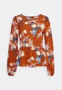 Peplum top v barvě rezavě oranžové z látky s květinovým potiskem v bílé, modré a zelené barvě. Dlouhé rukávy s nařasenými manžetami a kulatým výstřihem.
