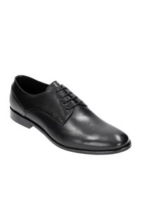 Scarpe eleganti in pelle nera con una finitura liscia, punta arrotondata e lacci a sei fori. Presentano un tacco basso e un discreto dettaglio del logo sul lato.