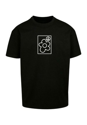 T-shirt nera in cotone con una grafica bianca di un fiore e un simbolo di pace all'interno di un quadrato. Collo rotondo, maniche corte, vestibilità rilassata.