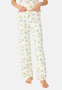 Lätta, vita pyjamabyxor med en färgglad, upprepad tryck av cocktails, lime och kaktusar. Elastisk midja med dragsko.