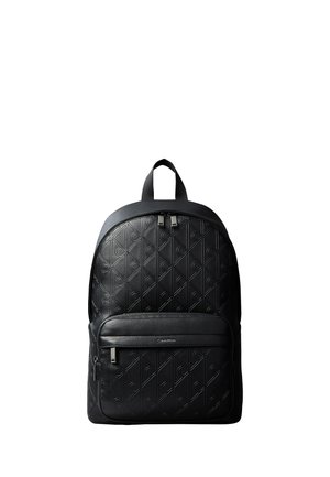 Black leather backpack embossed with a repeating "CK" pattern, front zipper pocket, top handle, and dual zipper closure.
