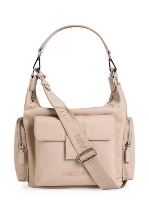 Beige leather handbag with front flap pocket, two side zip pockets, a wide adjustable branded shoulder strap, and a top handle.
