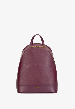 Sac à dos en cuir violet avec fermeture éclair et poignée dorées, corps texturé et logo Wittchen en or en bas au centre.