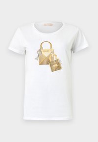 T-shirt bianco in cotone con una stampa che raffigura due borse dorate decorate, comprendenti una chiave e accenti simili a diamanti.