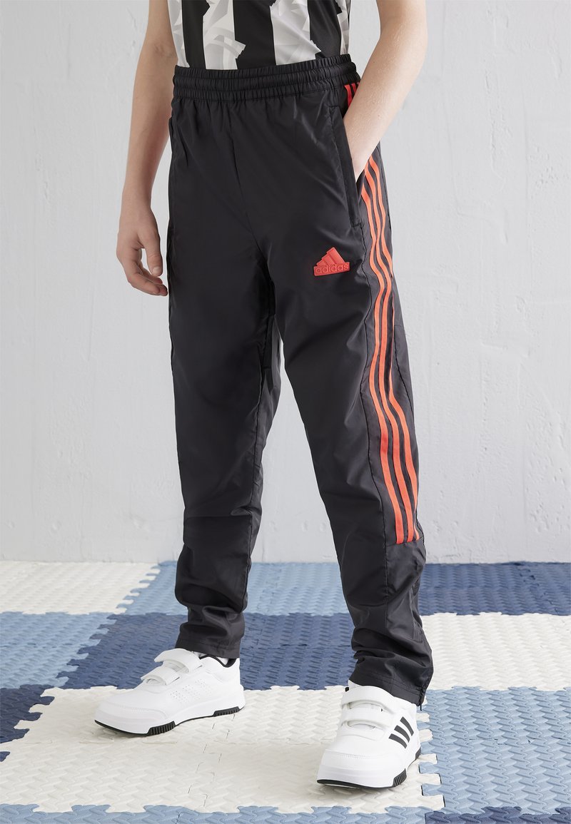 adidas Performance HOT TIRO JUNIOR UNISEX - Pantalon de survêtement - black/bright red