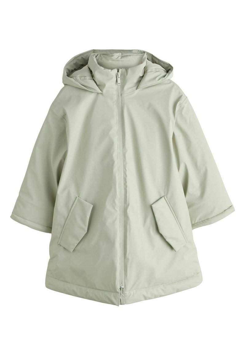 Gaiši zaļa necaurlaidīga jaka ar rāvējslēdzēja priekšpusi, kapuci un divām priekšējām kabatām. Raksturo brīvs piegriezums un vidēja garuma dizains. Gluda tekstūra.